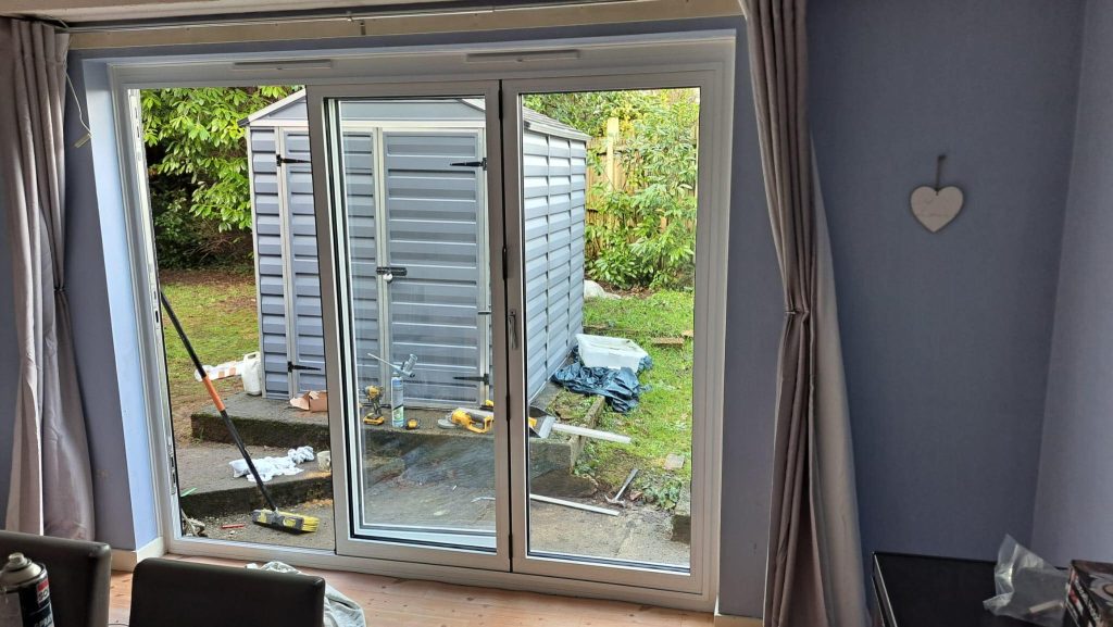 Aluminium back door with slim frame design for modern UK home extension.