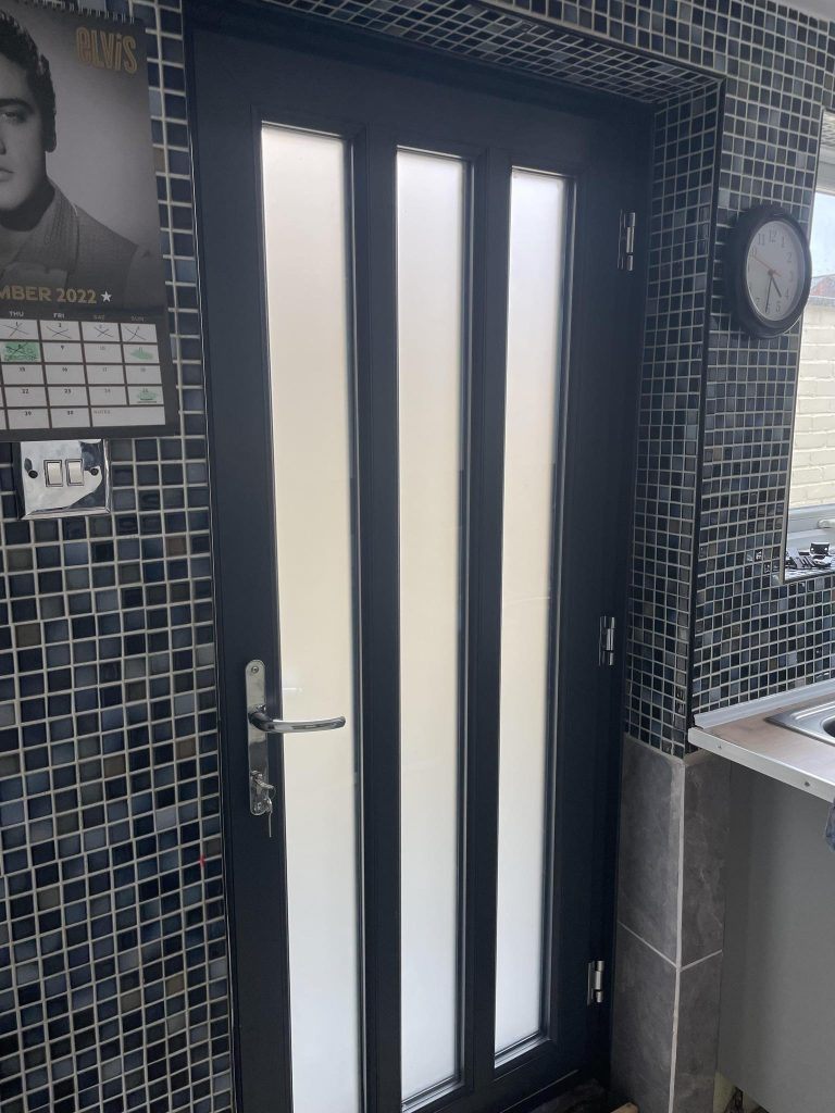 Modern uPVC back door in UK home with secure multi point locking system