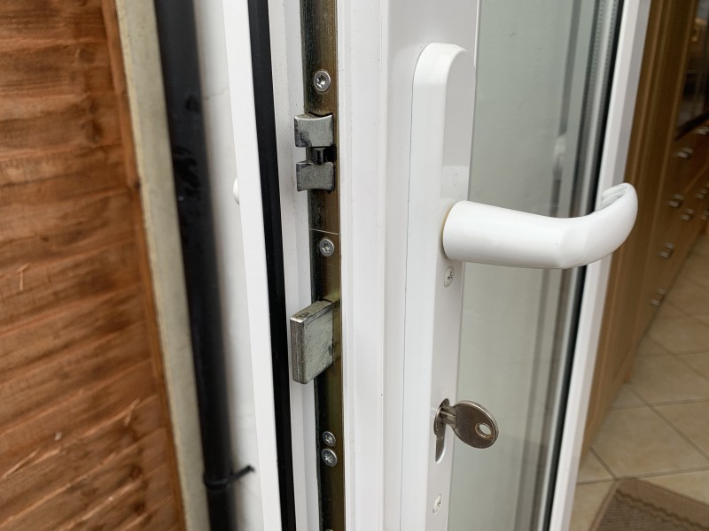 Close up view of multi point locking system installed on a modern uPVC front door from Doorland UK